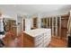 Well-organized walk-in closet with custom cabinetry, an island, and ample storage at 32602 Archdale, Chapel Hill, NC 27517