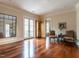 Bright sitting area with hardwood floors, French doors, and comfortable seating at 32602 Archdale Dr, Chapel Hill, NC 27517