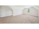 Attic bedroom featuring neutral carpet and a bright window at 35 Hewitt Wds Dr, Clayton, NC 27527