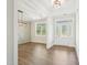 Bright foyer features wood floors, fresh white paint, and charming light fixtures at 35 Hewitt Wds Dr, Clayton, NC 27527