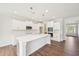 Bright Kitchen features white cabinets, quartz countertops, and stainless steel appliances at 35 Hewitt Wds Dr, Clayton, NC 27527