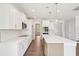 Open concept kitchen with a large island and stainless steel appliances at 35 Hewitt Wds Dr, Clayton, NC 27527