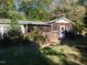 Single story home with a screened porch and deck at 3722 Durham Rd, Raleigh, NC 27614