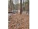 Snowy waterfront lot access with wooden fence and pink markers at 3722 Durham Rd, Raleigh, NC 27614