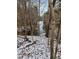 Peaceful waterfront lot with snow-covered ground and mature trees at 3722 Durham Rd, Raleigh, NC 27614