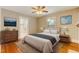 Main bedroom with hardwood floors and ceiling fan at 403 Laurel Hill Dr, Burlington, NC 27215