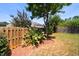 Landscaped backyard with wooden fence at 4052 Truelove Dr, Apex, NC 27539