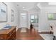 Hardwood floors in an entryway with views into an office and dining room at 4052 Truelove Dr, Apex, NC 27539