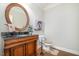 Stylish powder room with dark vanity and large mirror at 4132 Mountainbrook Rd, Apex, NC 27539