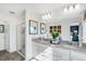 Elegant bathroom with double sinks, granite countertops, and a glass-enclosed shower at 435 Rowe Way, Knightdale, NC 27545