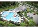 Rendering of a beautiful community pool and clubhouse with lounge chairs and ample parking at 435 Rowe Way, Knightdale, NC 27545