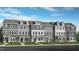 Three-story townhouses with gray siding, stone accents, and front porches at 435 Rowe Way, Knightdale, NC 27545