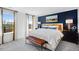 Comfortable main bedroom with ample natural light, dark blue accent wall, and coordinated furnishings at 435 Rowe Way, Knightdale, NC 27545