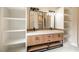 Modern bathroom with double vanity and built-in shelving at 4860 Fayetteville Rd, Durham, NC 27713