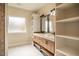 Bathroom with double vanity, shelving and marble flooring at 4860 Fayetteville Rd, Durham, NC 27713