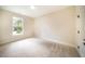 Bright and spacious bedroom with neutral colored carpet at 4860 Fayetteville Rd, Durham, NC 27713