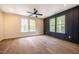 Bright bedroom with hardwood floors and multiple windows at 4860 Fayetteville Rd, Durham, NC 27713