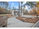 Two-story house with driveway and landscaped yard at 4860 Fayetteville Rd, Durham, NC 27713