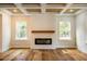 Modern fireplace with shiplap wall and wood mantel at 4860 Fayetteville Rd, Durham, NC 27713