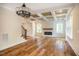 Living room features hardwood floors, fireplace, and coffered ceiling at 4860 Fayetteville Rd, Durham, NC 27713