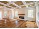 Living room features hardwood floors, fireplace, and large windows at 4860 Fayetteville Rd, Durham, NC 27713