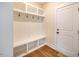 White built-in bench with cubbies and hooks at 4860 Fayetteville Rd, Durham, NC 27713