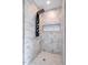 Spa-like shower with multiple shower heads and marble tile at 4860 Fayetteville Rd, Durham, NC 27713