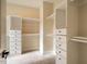 Spacious walk-in closet with ample shelving and drawers at 4860 Fayetteville Rd, Durham, NC 27713