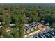 An aerial perspective features a residential area bordered by dense woodland and new housing at 5041 Lundy Dr # 101, Raleigh, NC 27606