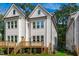 Beautiful backyard deck with wooden stairs and lush green landscaping for outdoor enjoyment at 5041 Lundy Dr # 101, Raleigh, NC 27606