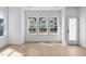 Bright dining area with hardwood floors and access to a back deck at 5041 Lundy Dr # 101, Raleigh, NC 27606