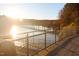 A serene lake view showcases a boardwalk and sunlight, ideal for outdoor walks and peaceful scenery at 5041 Lundy Dr # 101, Raleigh, NC 27606