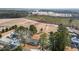 Wide aerial shot of rural property near cultivated land with sparse winter ground cover at 5088 Christian Light Rd, Fuquay Varina, NC 27526