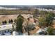 Aerial view of large rural property with wooded areas and sparse winter ground cover at 5088 Christian Light Rd, Fuquay Varina, NC 27526