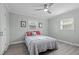Bright bedroom featuring a comfortable bed and ceiling fan at 5088 Christian Light Rd, Fuquay Varina, NC 27526