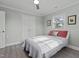 Light and airy bedroom with double doors and ceiling fan at 5088 Christian Light Rd, Fuquay Varina, NC 27526
