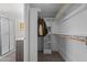 Bright walk-in closet with wood-look floors at 5088 Christian Light Rd, Fuquay Varina, NC 27526