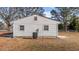 The side exterior of a house, painted white, and has 2 windows visible at 5088 Christian Light Rd, Fuquay Varina, NC 27526