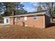 Brick exterior of house with visible pipes, windows, and electrical boxes at 5088 Christian Light Rd, Fuquay Varina, NC 27526