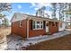 Charming brick home with white trim and a welcoming front entrance, showcasing its classic architectural style and curb appeal at 5088 Christian Light Rd, Fuquay Varina, NC 27526