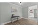 Foyer with light wood floors and view into the dining room at 5088 Christian Light Rd, Fuquay Varina, NC 27526