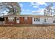 Charming brick and siding home with a welcoming front entrance and well-maintained lawn and driveway at 5088 Christian Light Rd, Fuquay Varina, NC 27526