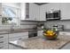 Modern kitchen with white cabinets, granite countertops, and stainless steel appliances at 5088 Christian Light Rd, Fuquay Varina, NC 27526