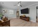 Bright living room with hardwood floors and ceiling fan at 5088 Christian Light Rd, Fuquay Varina, NC 27526