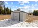 Metal outbuilding in the backyard with some snow on the ground at 5088 Christian Light Rd, Fuquay Varina, NC 27526