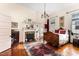 Elegant bedroom featuring hardwood floors, fireplace, and antique bed at 517 N East St, Raleigh, NC 27604