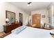 Spacious bedroom with hardwood floors and an antique wardrobe at 517 N East St, Raleigh, NC 27604