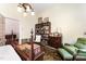 Cozy bedroom with hardwood floors, built-in bookcase and green armchair at 517 N East St, Raleigh, NC 27604