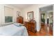 Comfortable bedroom with hardwood floors and built-in dresser at 517 N East St, Raleigh, NC 27604