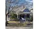 Charming Victorian home featuring a wraparound porch and well-manicured lawn at 517 N East St, Raleigh, NC 27604